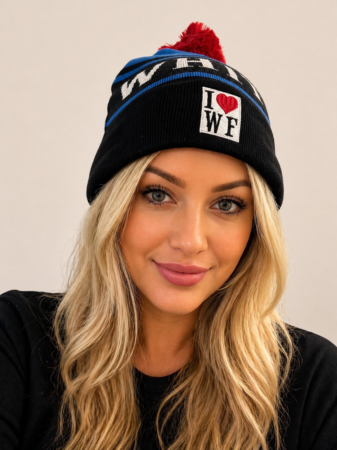 Whitefish Heritage Beanie - Black knit with blue stripes and red pompom